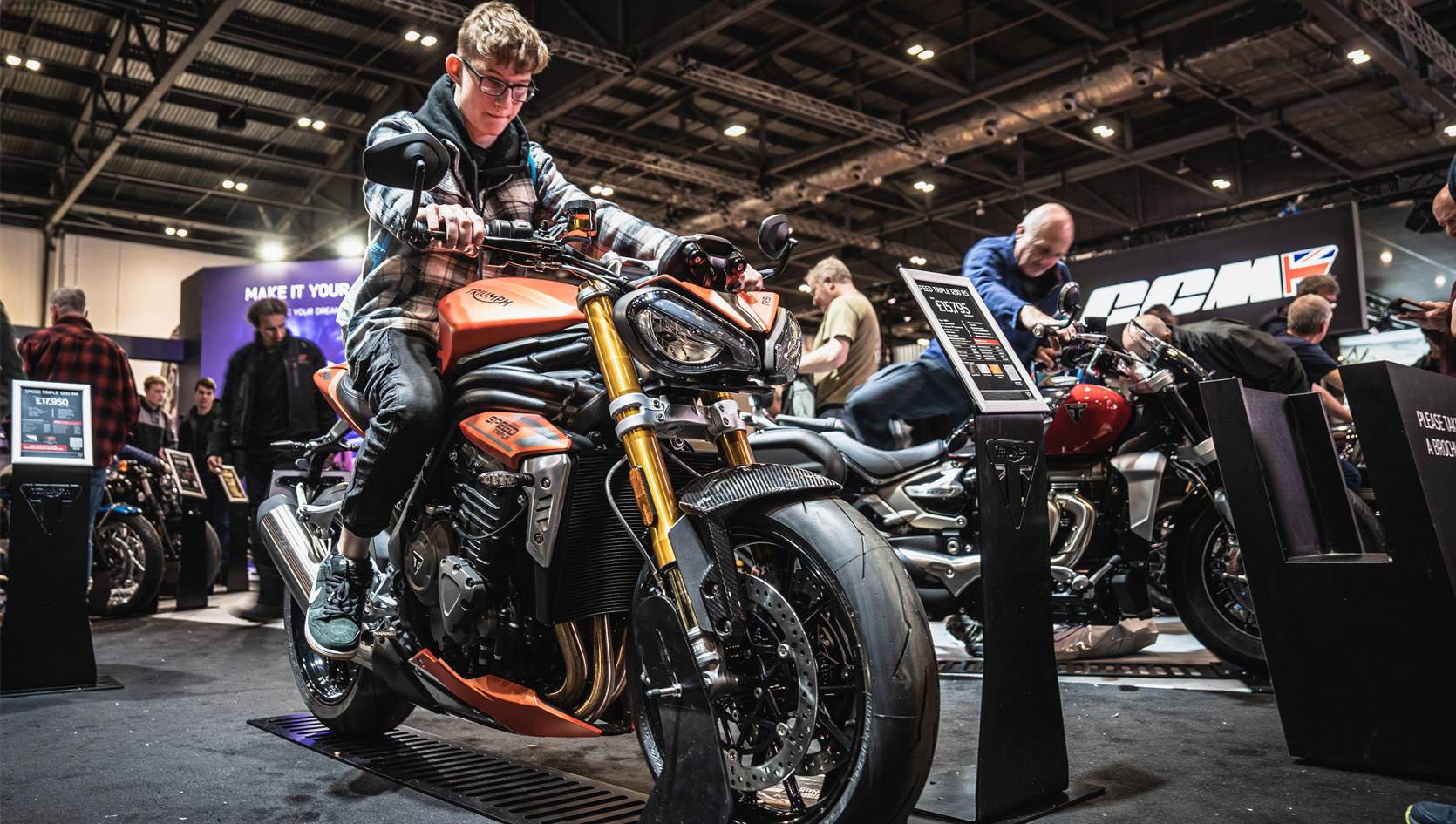 Show visitor trying out a new bike for size